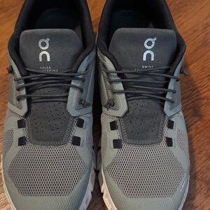 On Running Black and Green Athletic Shoes with CloudTec Cushioning